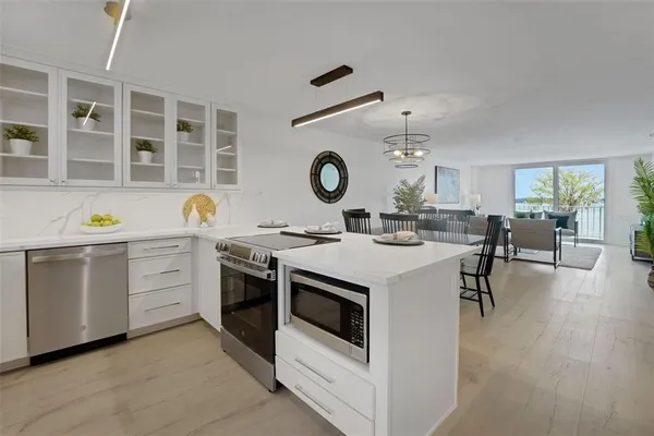 a kitchen with a stove oven and a window