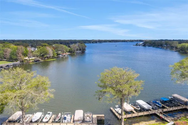 an aerial view of a house with a lake view