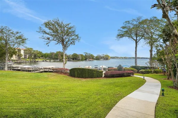 a view of a lake with houses in the background