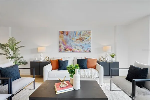 a living room with furniture and a rug