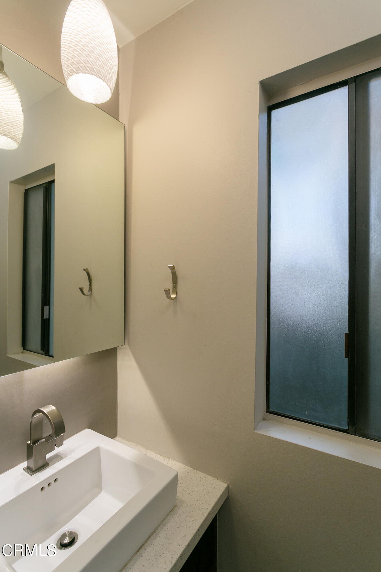 1050 Seco Street, Unit 210 Pasadena, CA 91103 - Photo 8 of 14 a bathroom with a sink and a mirror