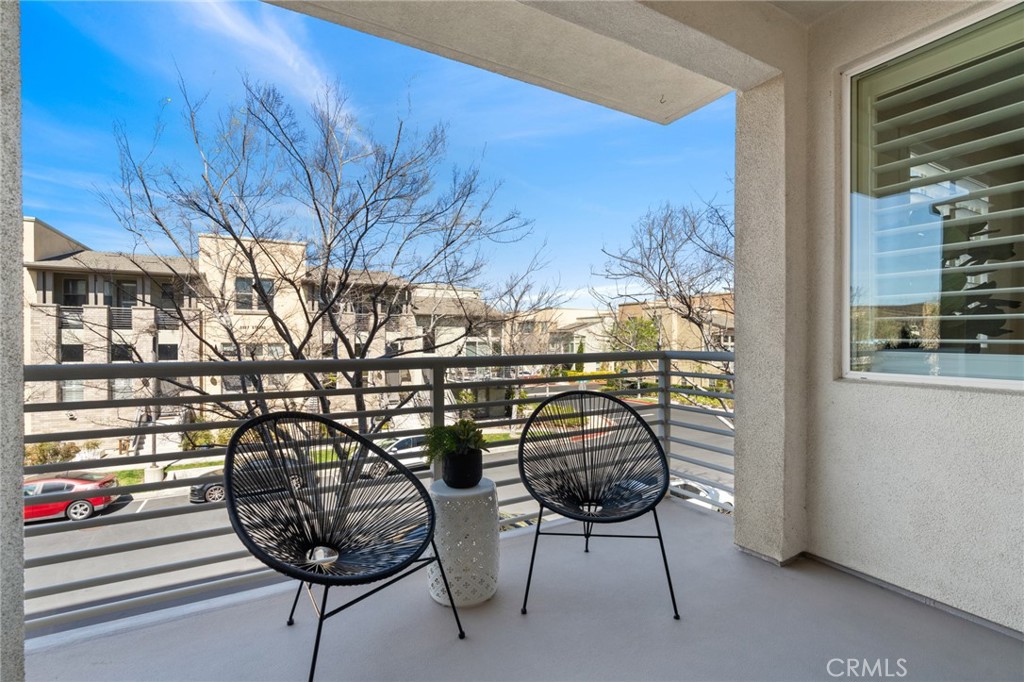 5540 Strand, Unit 201 Hawthorne, CA 90250 - Photo 12 of 31 a view of a chairs and table in a balcony