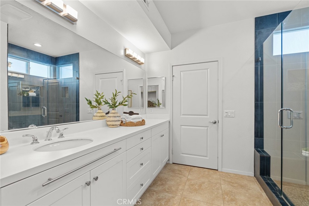 5540 Strand, Unit 201 Hawthorne, CA 90250 - Photo 17 of 31 a bathroom with a double vanity sink mirror and shower