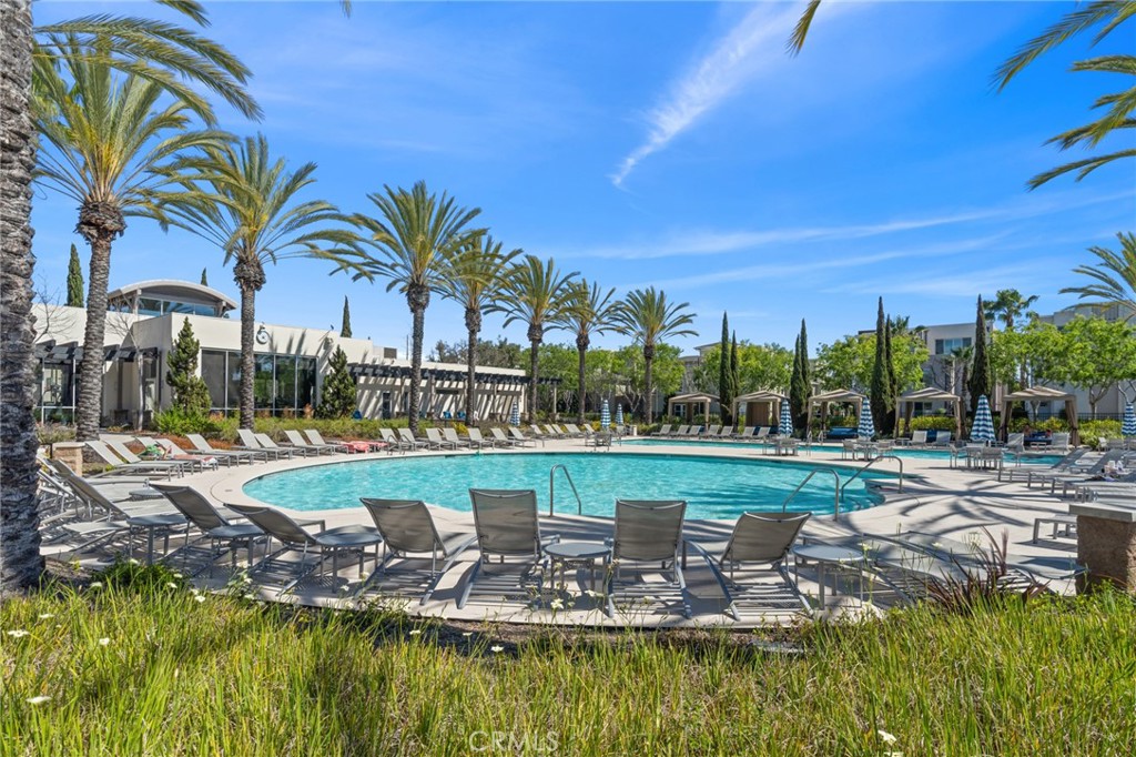5540 Strand, Unit 201 Hawthorne, CA 90250 - Photo 24 of 31 a view of a swimming pool with a table and chairs