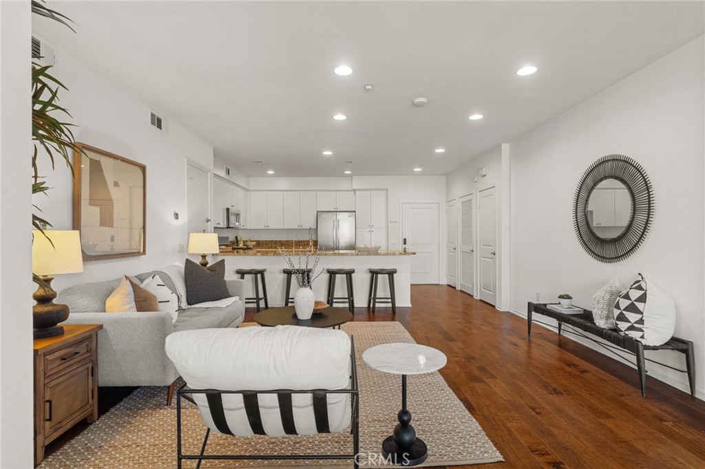 5540 Strand, Unit 201 Hawthorne, CA 90250 - Photo 4 of 31 a living room with furniture and a wooden floor