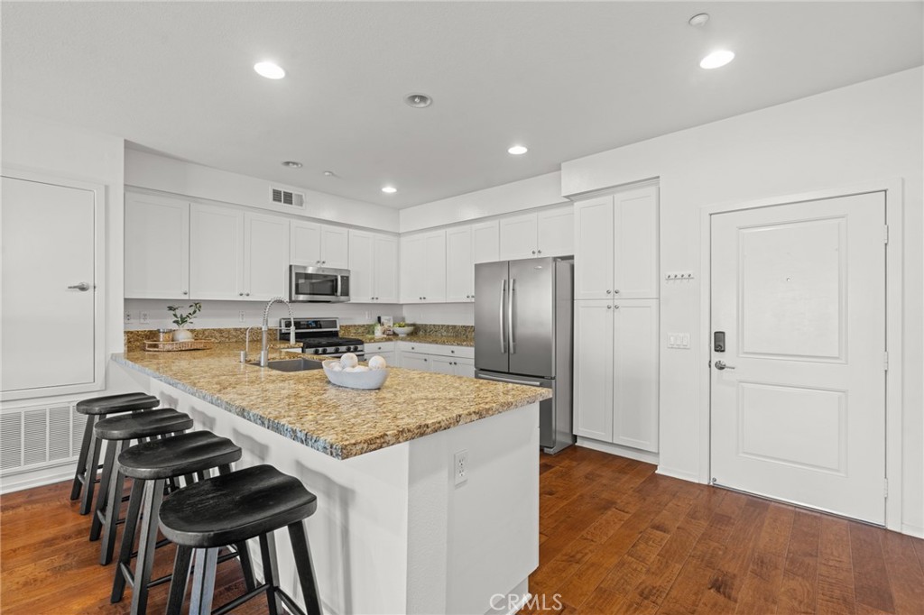 5540 Strand, Unit 201 Hawthorne, CA 90250 - Photo 6 of 31 a kitchen with stainless steel appliances granite countertop a sink stove and refrigerator