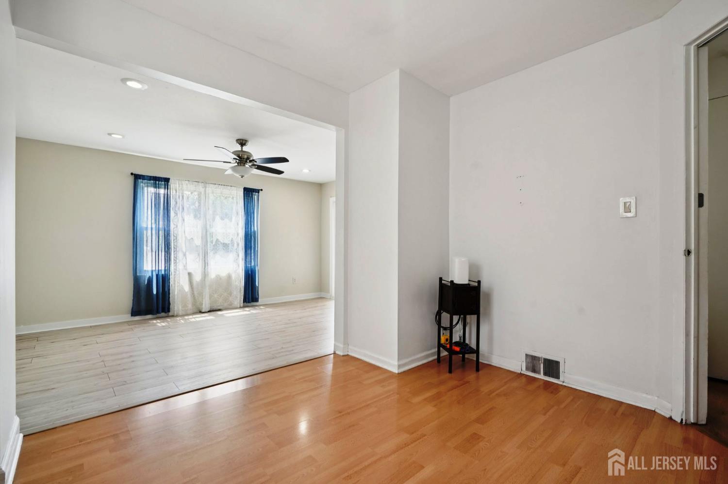 27 George Street Avenel, NJ 07001 - Photo 15 of 29 a view of an empty room with wooden floor