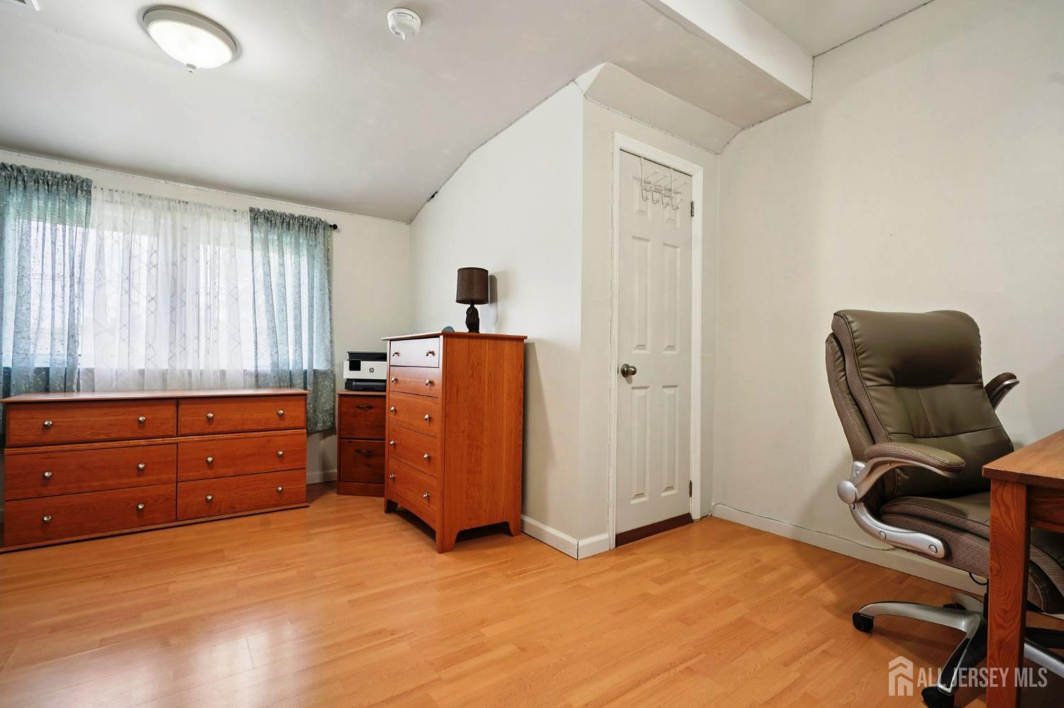 27 George Street Avenel, NJ 07001 - Photo 18 of 29 a room with furniture and a window