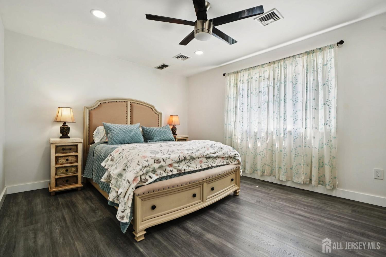 27 George Street Avenel, NJ 07001 - Photo 20 of 29 a bedroom with a bed closet and wooden floor