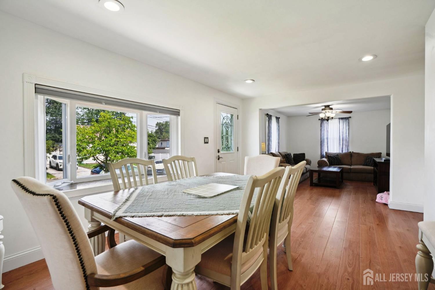 27 George Street Avenel, NJ 07001 - Photo 7 of 29 a view of a dining room with furniture window and wooden floor