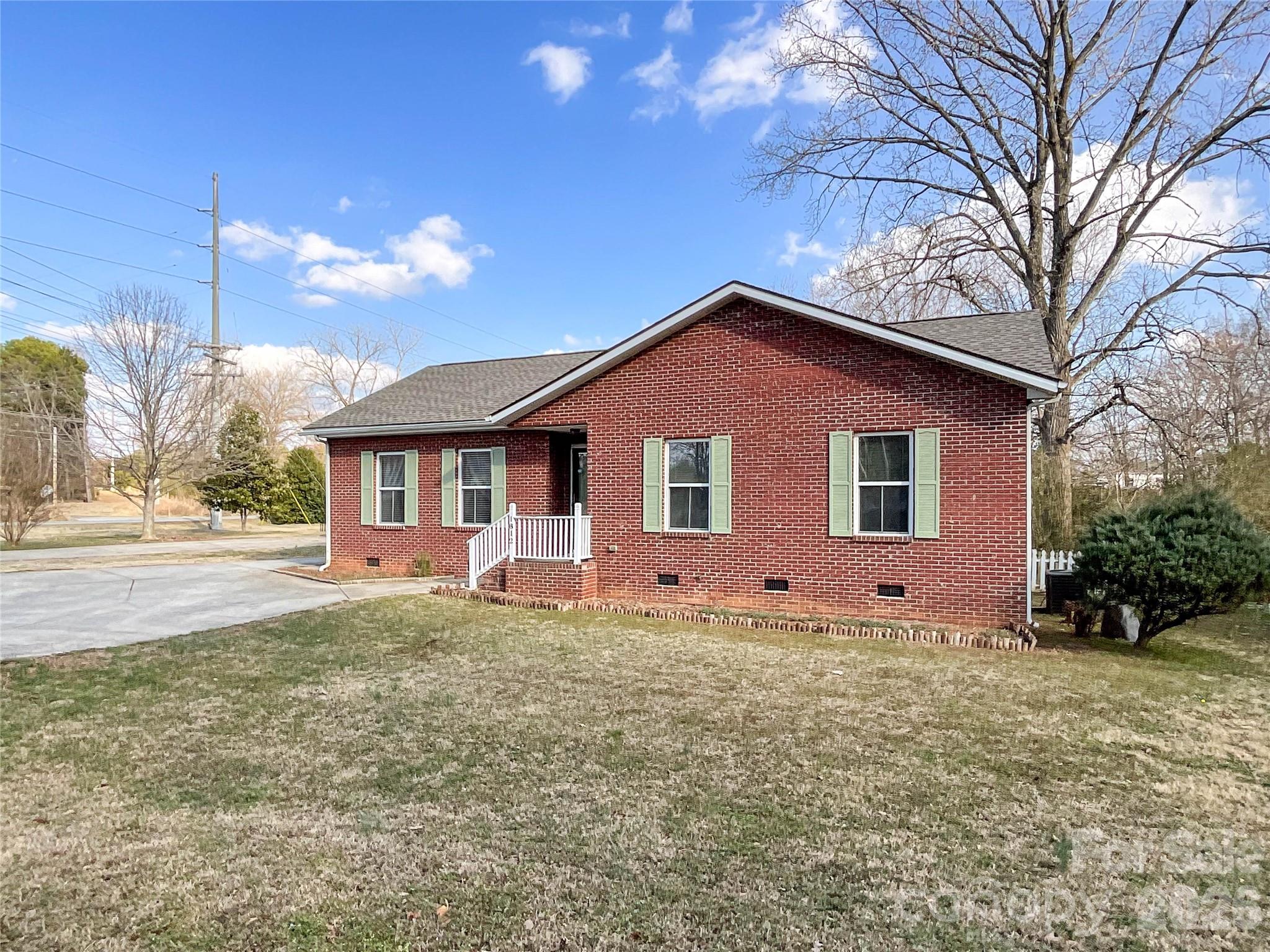 1812 Icemorlee Street Monroe, NC 28110 - Photo 1 of 18 a front view of a house with a yard