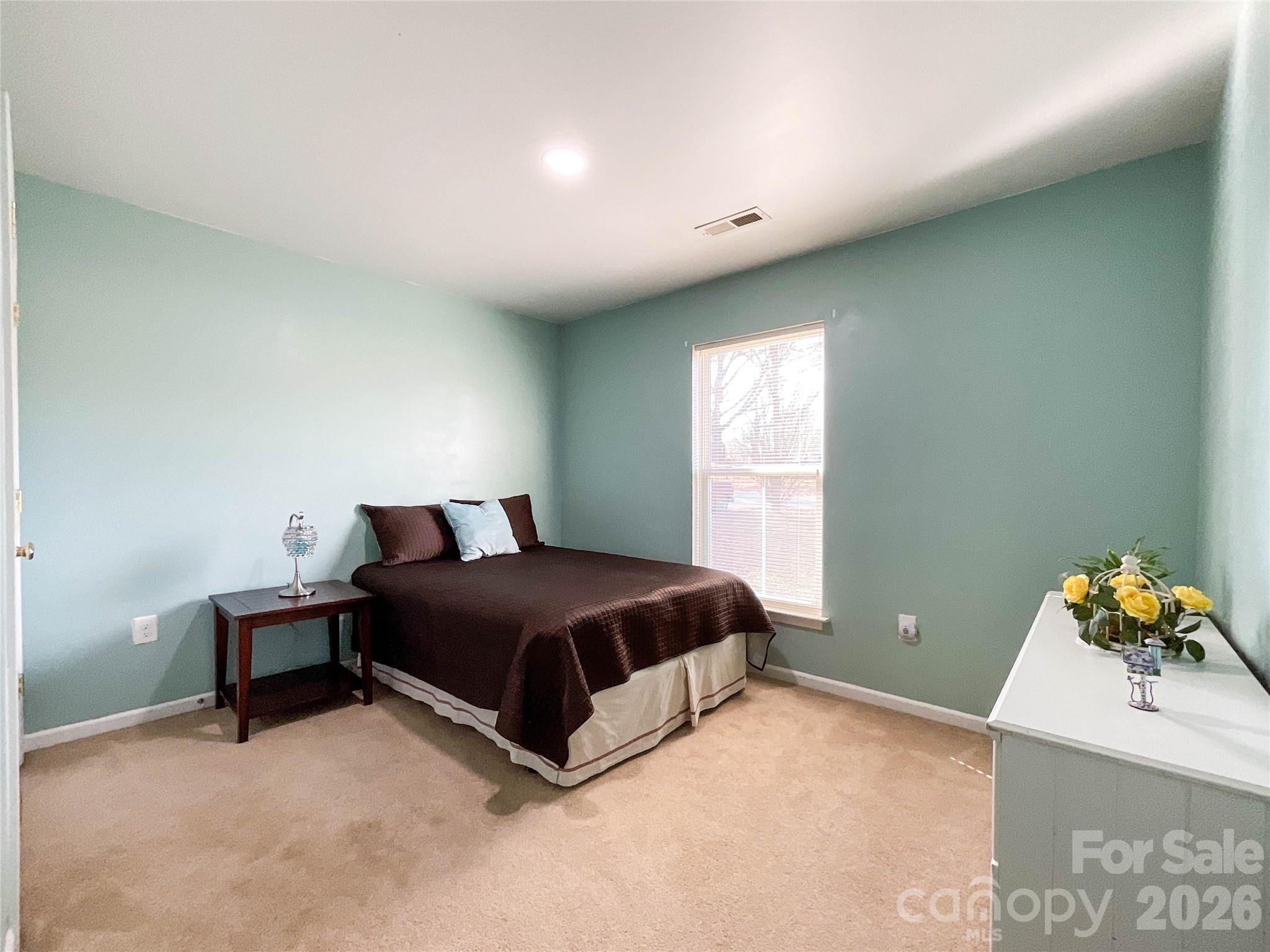 1812 Icemorlee Street Monroe, NC 28110 - Photo 11 of 18 a room with a bed and a window