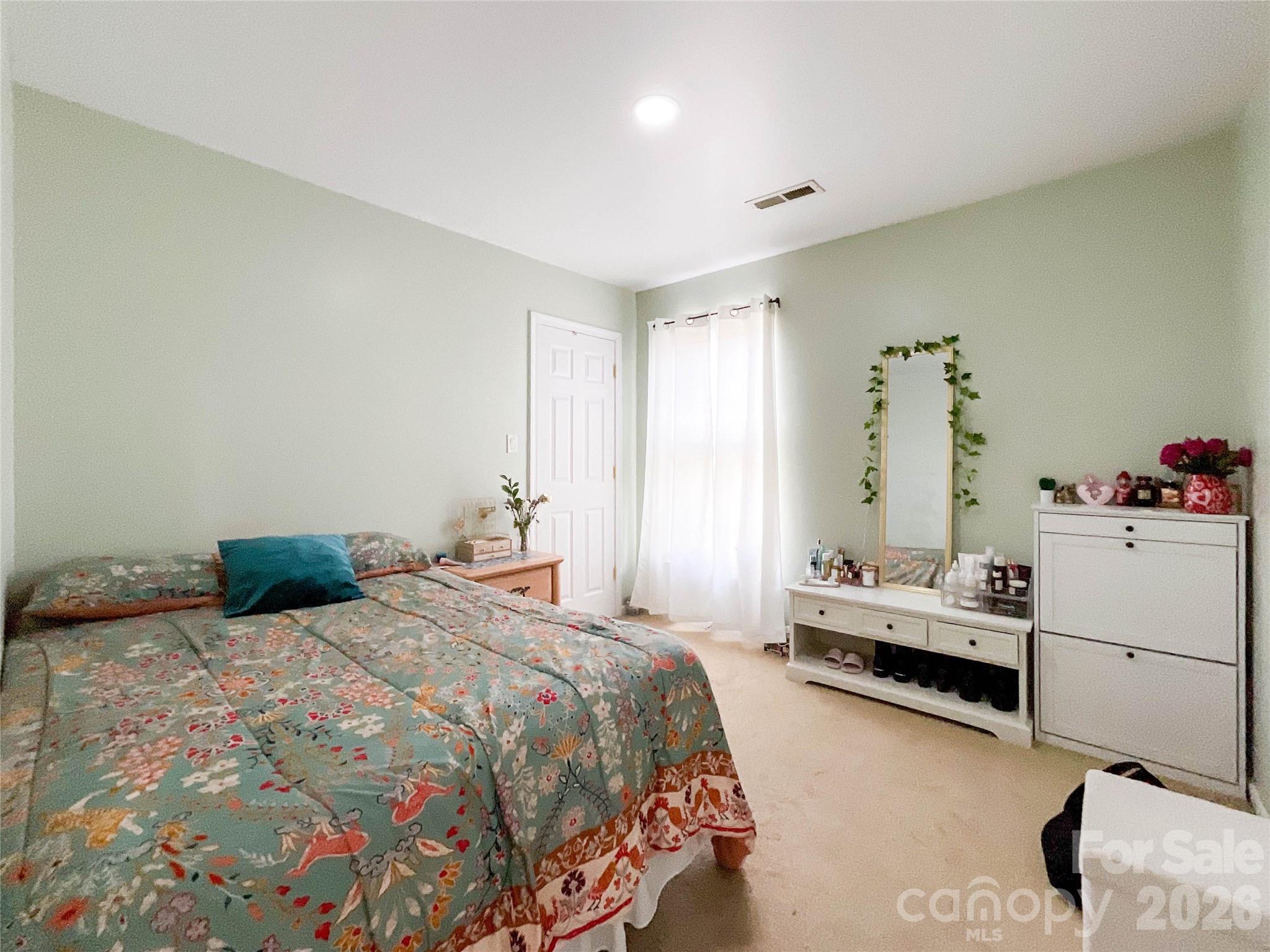1812 Icemorlee Street Monroe, NC 28110 - Photo 14 of 18 a bedroom with a bed and a window