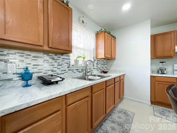 a kitchen with sink cabinets and window