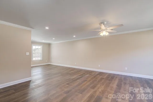 a kitchen with stainless steel appliances granite countertop a sink a stove a refrigerator and a microwave