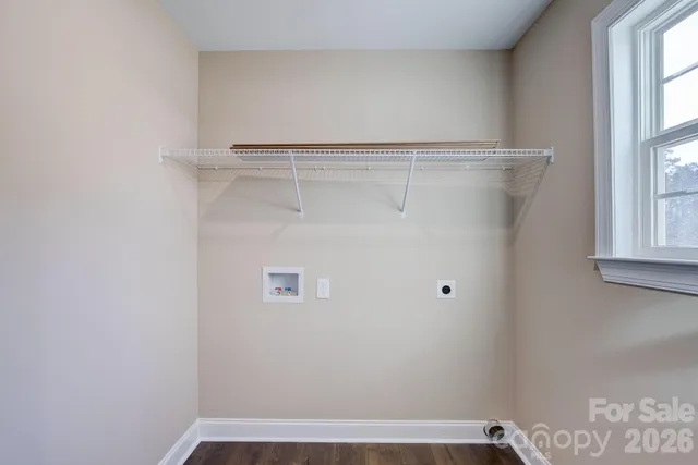 an empty room with closet and a ceiling fan