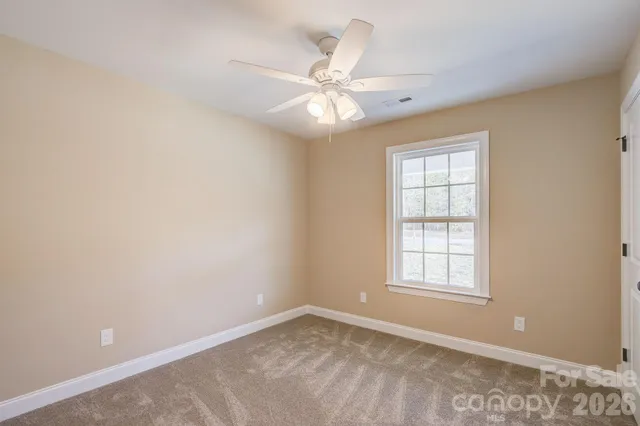 a view of a backyard of the house