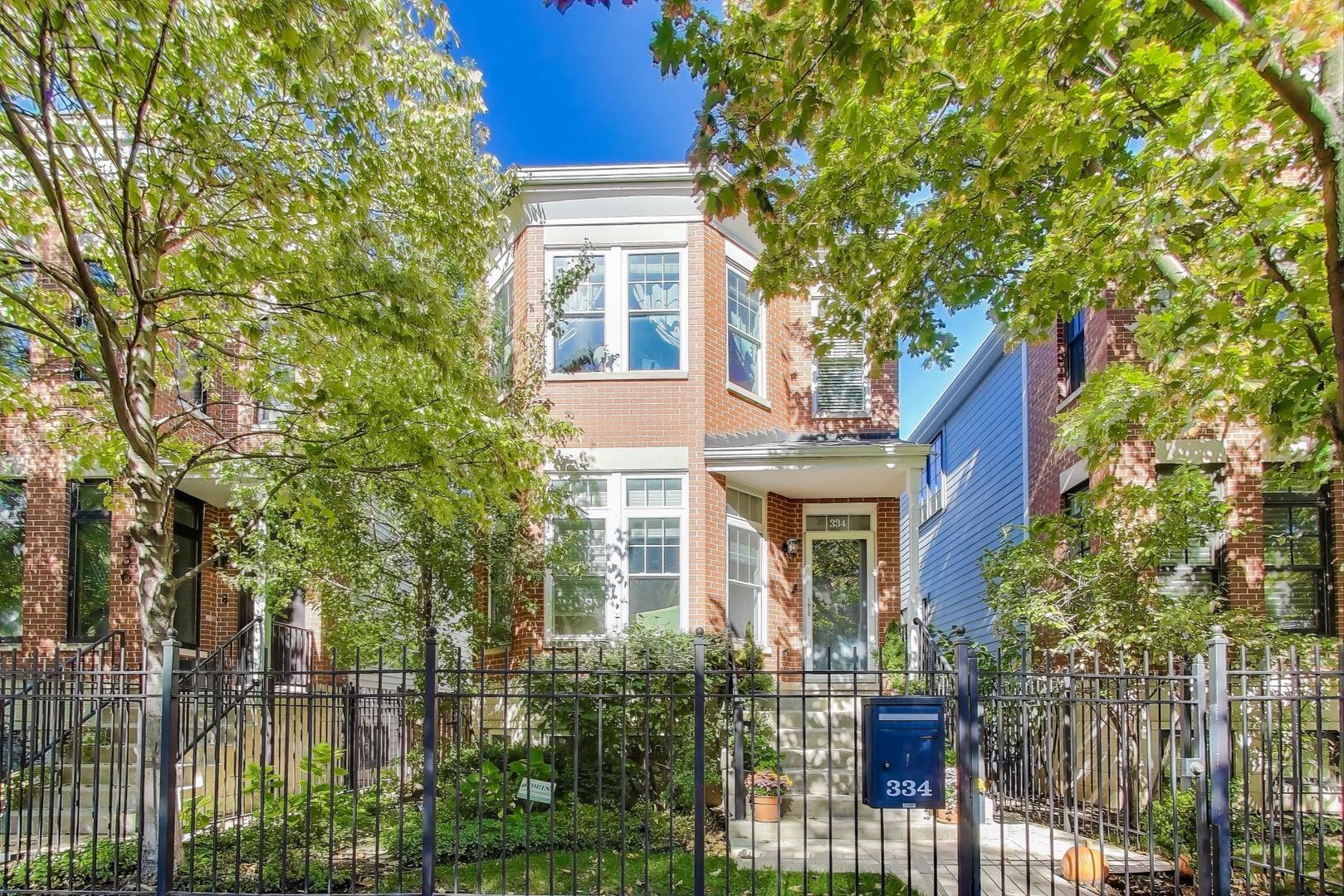 front view of house with a tree