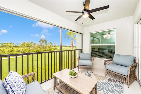 a view of a golf course with an ocean