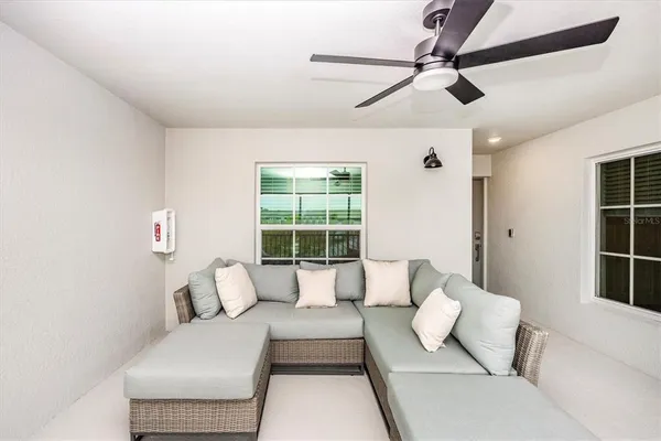 a living room with furniture and a large window