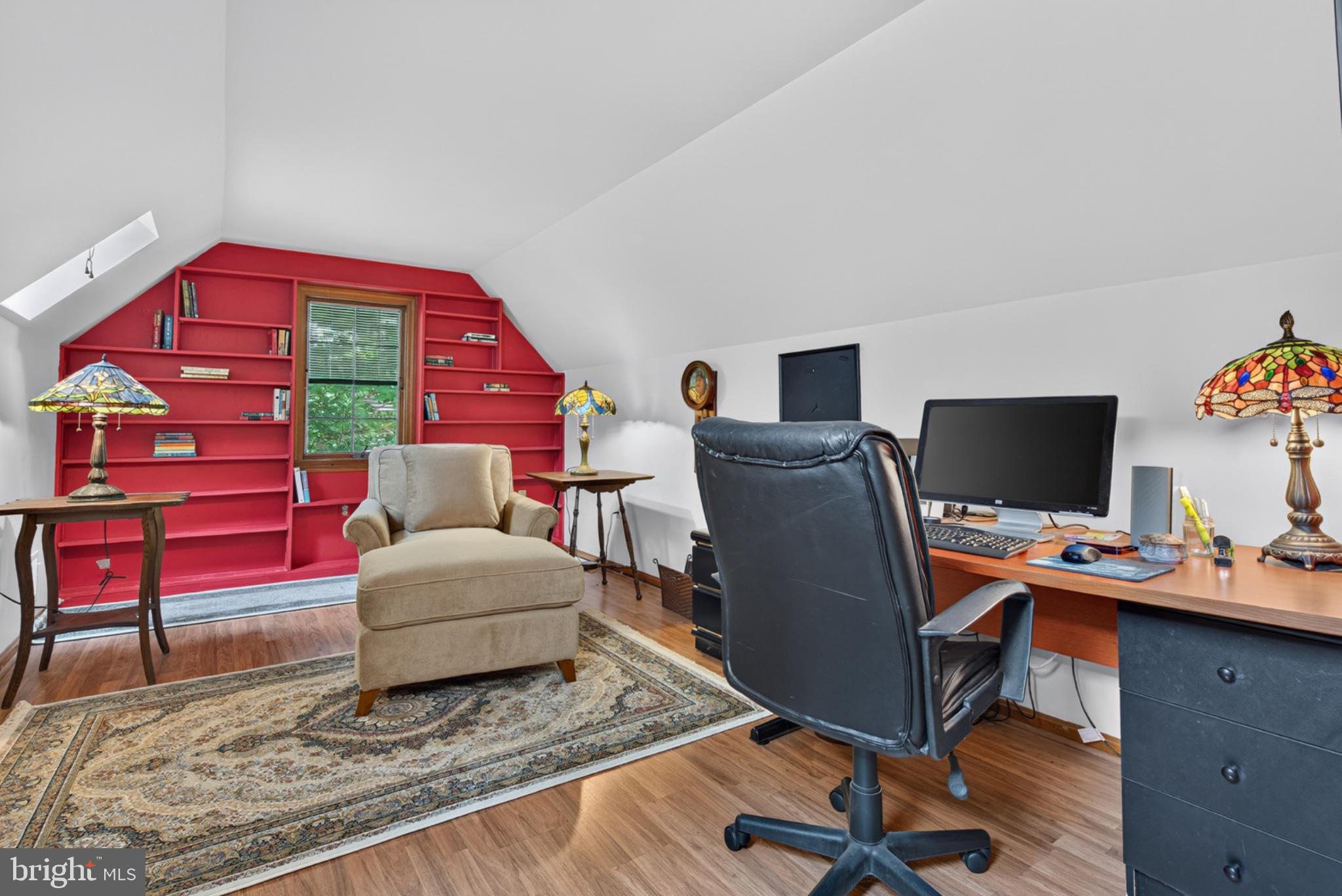 2861 Spring Valley Road Lancaster, PA 17601 - Photo 27 of 59 Charming attic workspace with vibrant shelves.