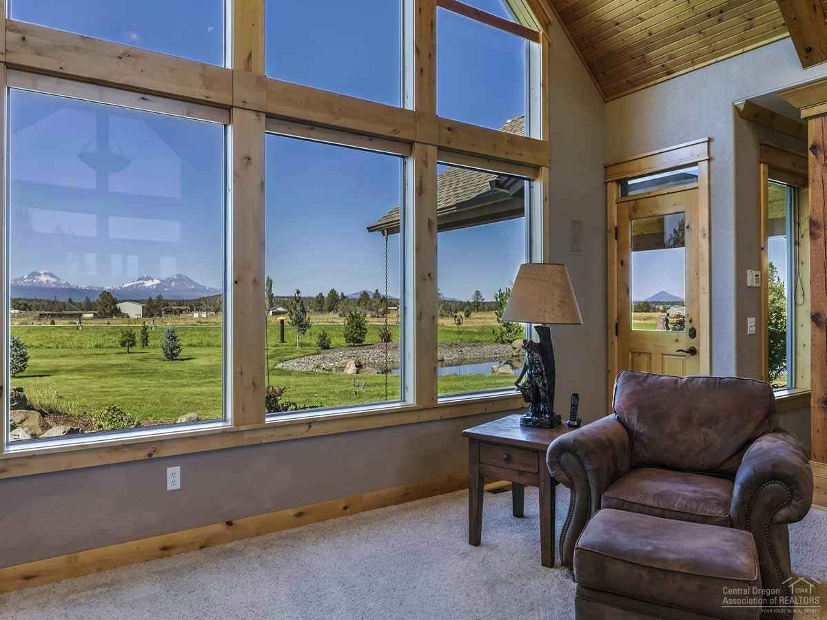 20200 Marsh Road Bend, OR 97703 - Photo 6 of 25 a living room with furniture and a large window