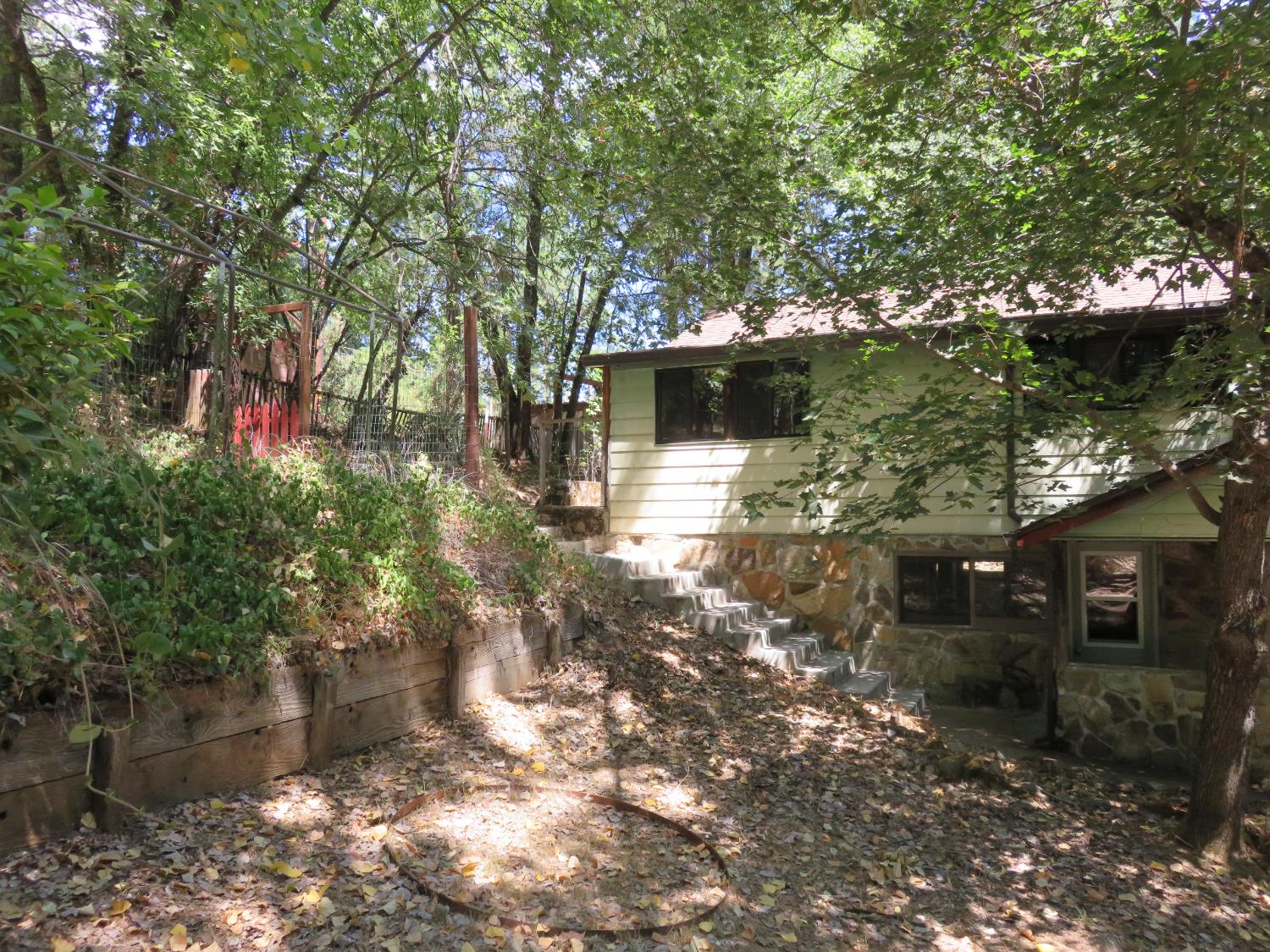 2563 Woodhouse Mine Road West Point, CA 95255 - Photo 6 of 49 a backyard of a house with lots of green space