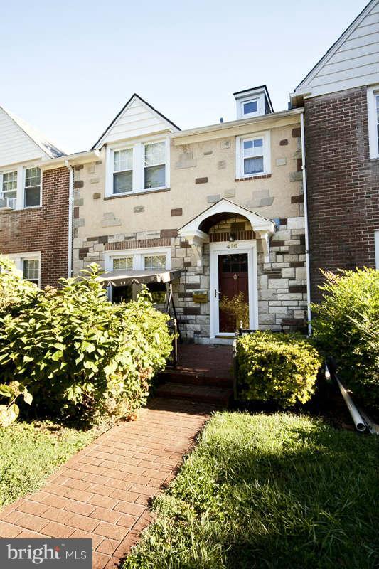 416 Hopkins Road Baltimore, MD 21212 - Photo 1 of 30 a front view of a house with a garden