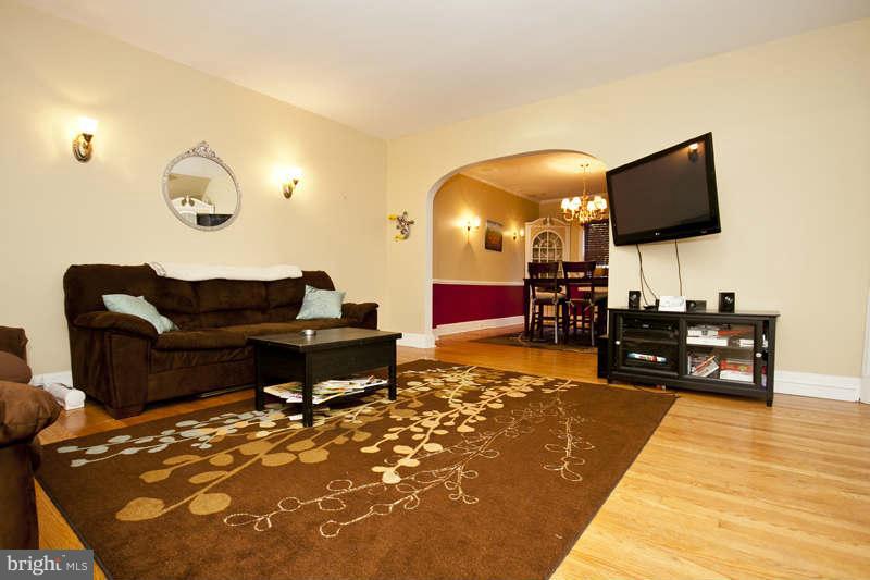 416 Hopkins Road Baltimore, MD 21212 - Photo 2 of 30 a living room with furniture and a flat screen tv