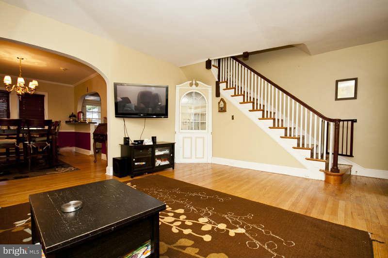 416 Hopkins Road Baltimore, MD 21212 - Photo 3 of 30 a living room with furniture and a flat screen tv