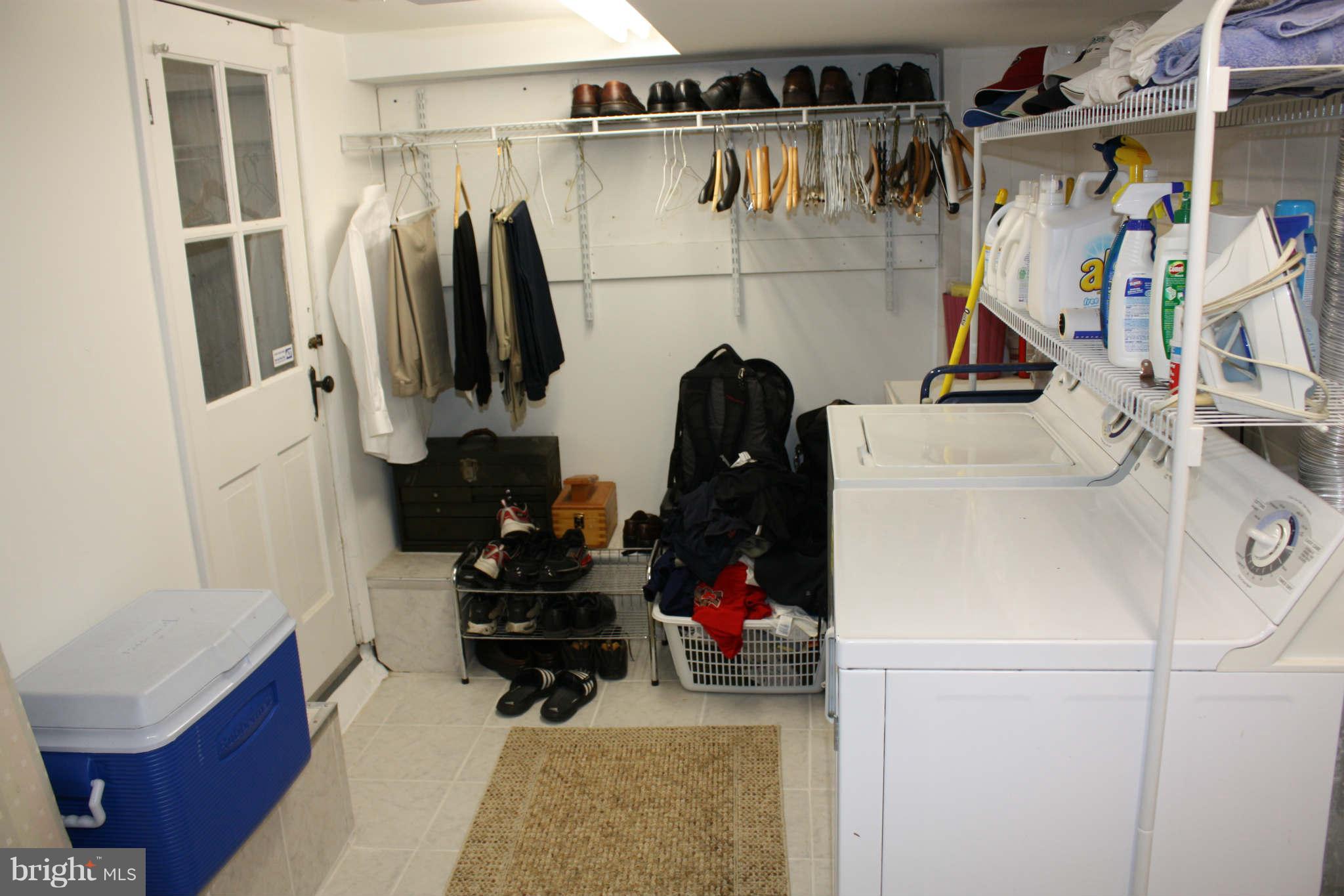 416 Hopkins Road Baltimore, MD 21212 - Photo 24 of 30 a view of walk in closet with clothes and shoes