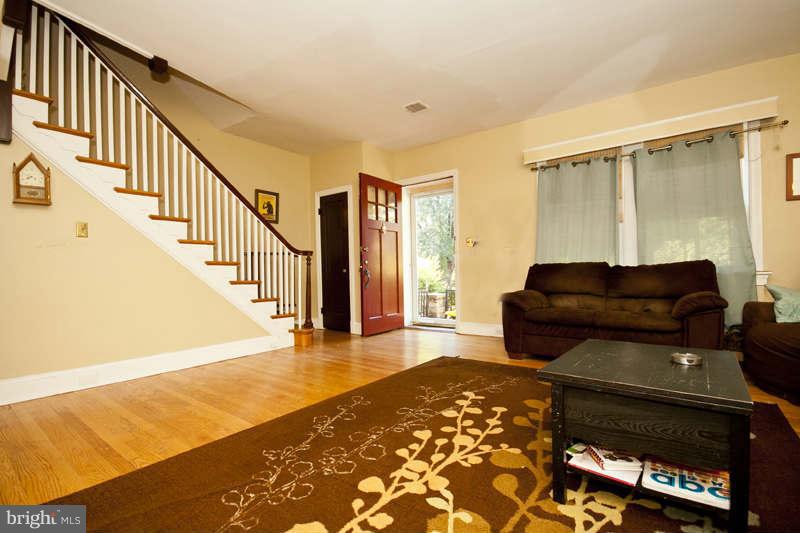 416 Hopkins Road Baltimore, MD 21212 - Photo 4 of 30 a living room with furniture and a rug