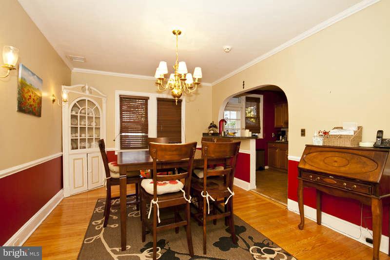 416 Hopkins Road Baltimore, MD 21212 - Photo 6 of 30 a view of a dining room with furniture and chandelier