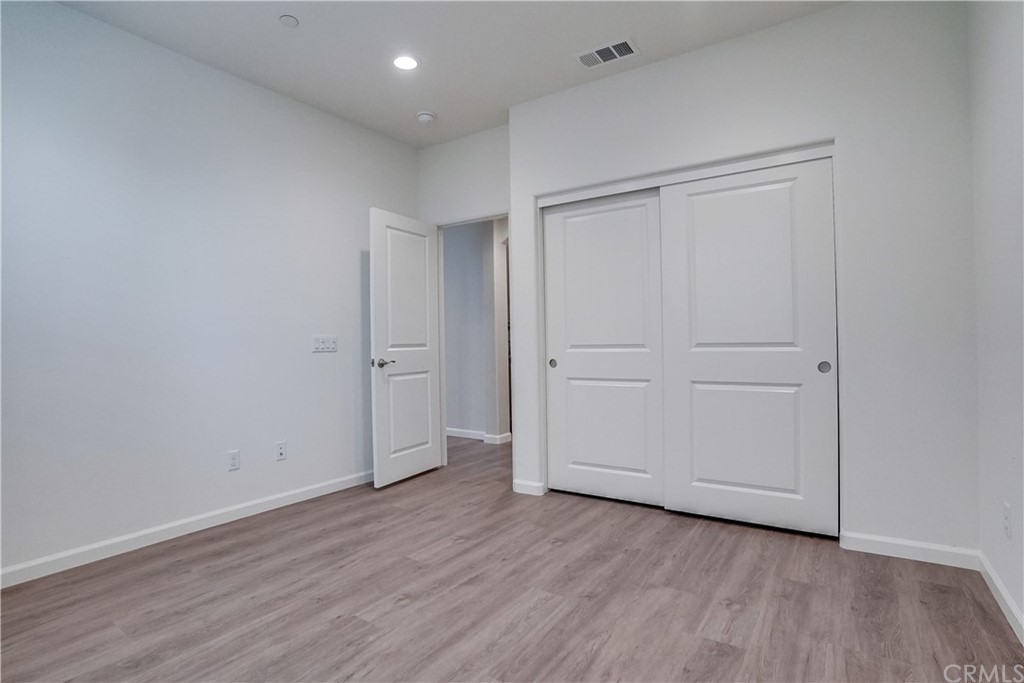 8257 Bella Rosa Drive Rosemead, CA 91770 - Photo 18 of 32 a view of an empty room with wooden floor
