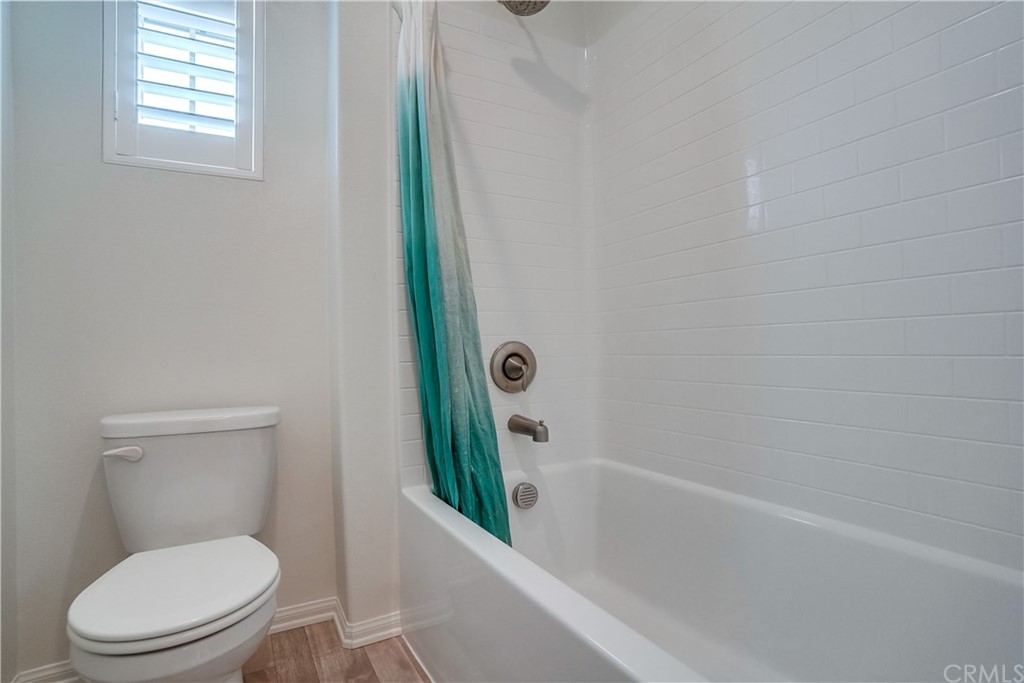 8257 Bella Rosa Drive Rosemead, CA 91770 - Photo 23 of 32 a bathroom with a toilet and a bathtub