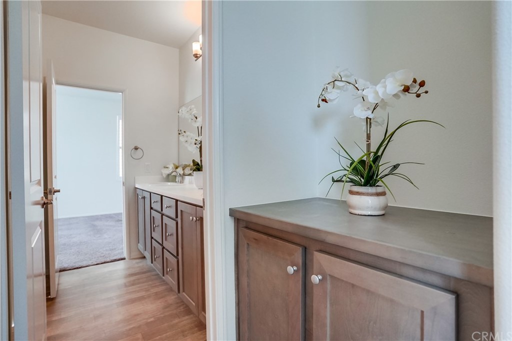 8257 Bella Rosa Drive Rosemead, CA 91770 - Photo 24 of 32 a bathroom with a sink a potted plant and a mirror