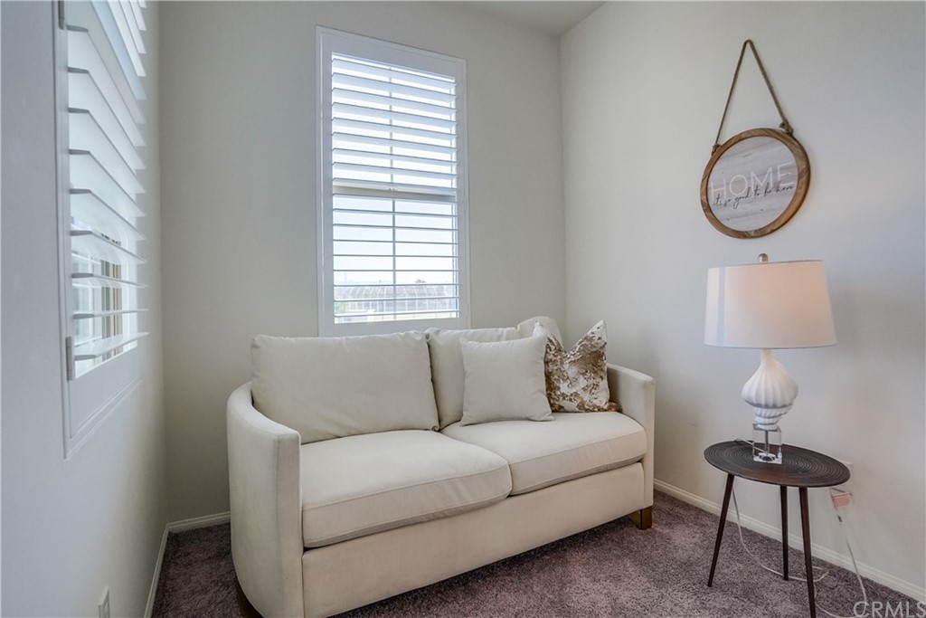 8257 Bella Rosa Drive Rosemead, CA 91770 - Photo 25 of 32 a living room with furniture a window and a lamp