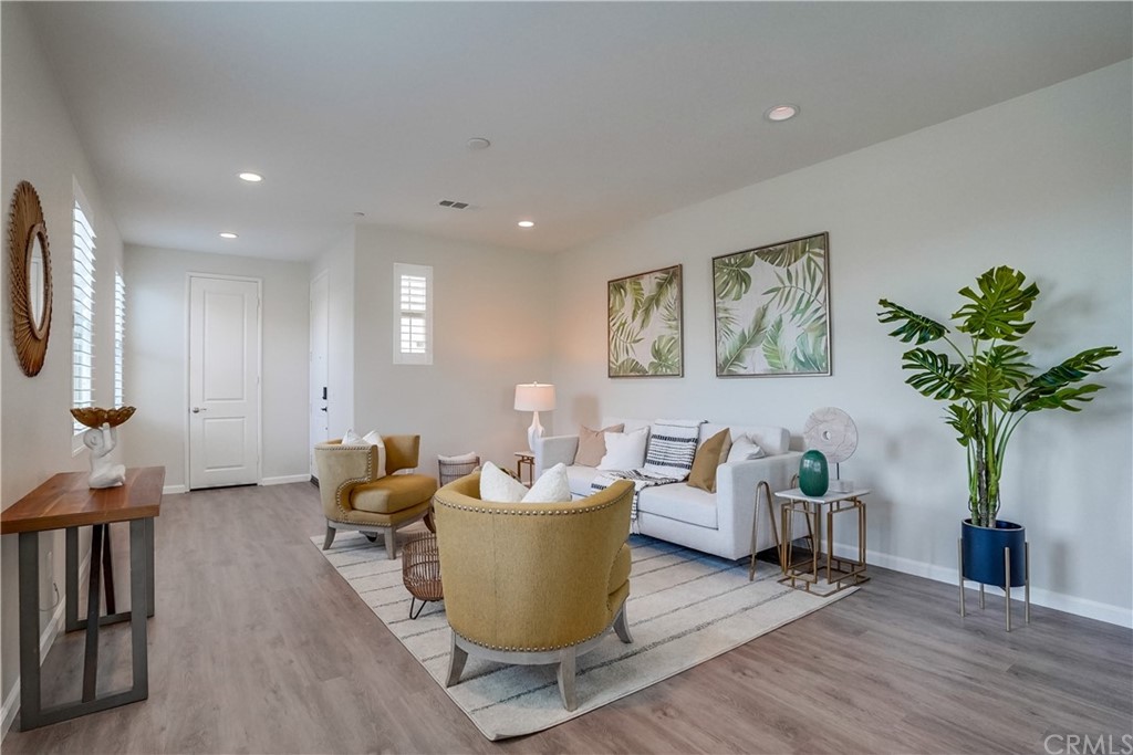 8257 Bella Rosa Drive Rosemead, CA 91770 - Photo 5 of 32 a living room with furniture a potted plant and a table