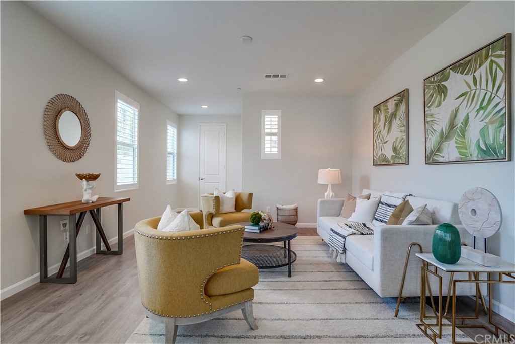 8257 Bella Rosa Drive Rosemead, CA 91770 - Photo 6 of 32 a living room with furniture and a wooden floor
