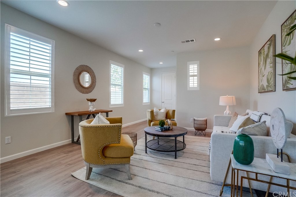 8257 Bella Rosa Drive Rosemead, CA 91770 - Photo 8 of 32 a living room with furniture and wooden floor