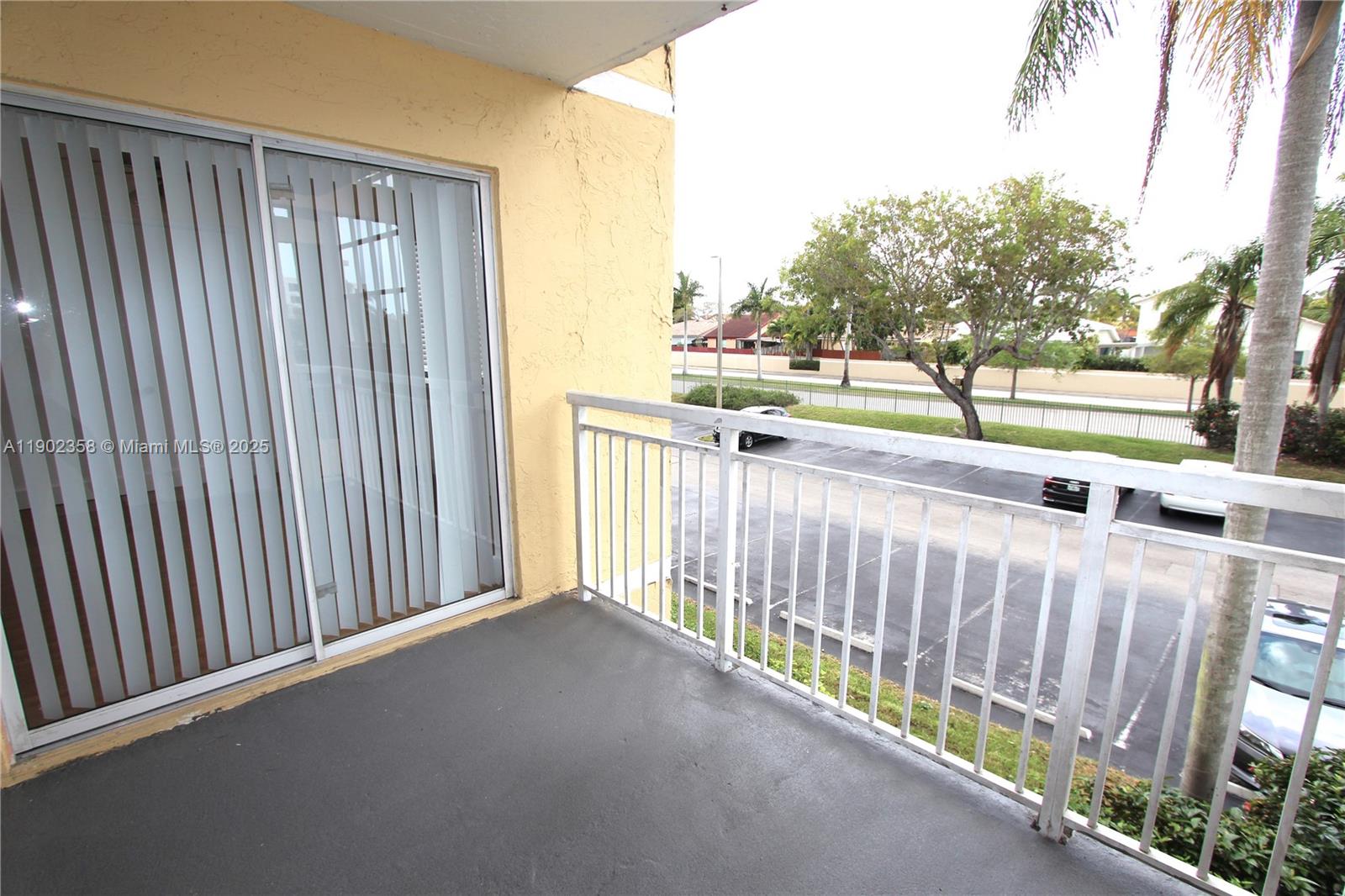 8540 Southwest 212th Street, Unit 203 Cutler Bay, FL 33189 - Photo 12 of 29 a view of a street view from a balcony