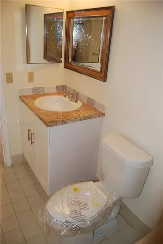 a bathroom with a sink and mirror