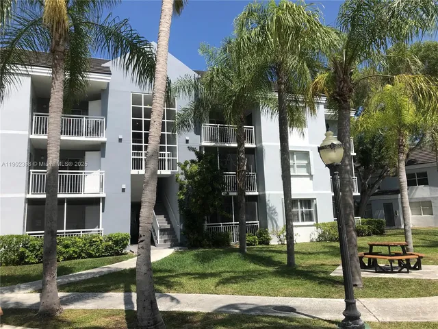 a view of building and car parked