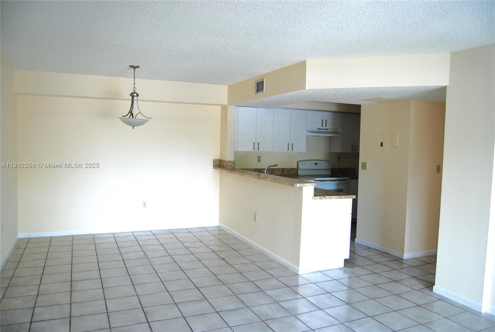8540 Southwest 212th Street, Unit 203 Cutler Bay, FL 33189 - Photo 3 of 29 a kitchen with a sink and a stove