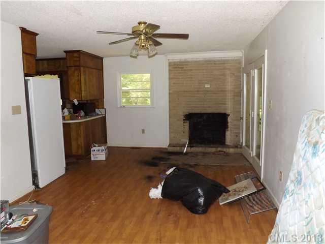 650 Stone Road Salisbury, NC 28146 - Photo 4 of 4 a living room with furniture and a fireplace