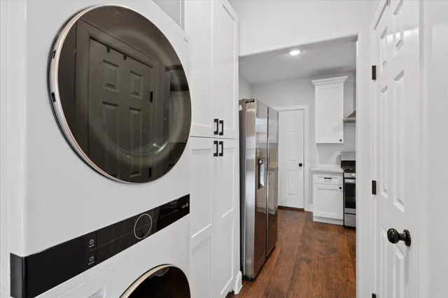 view of a livingroom with wooden floor washer and dryer