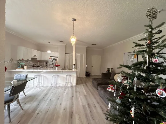 a view of a kitchen and dining room