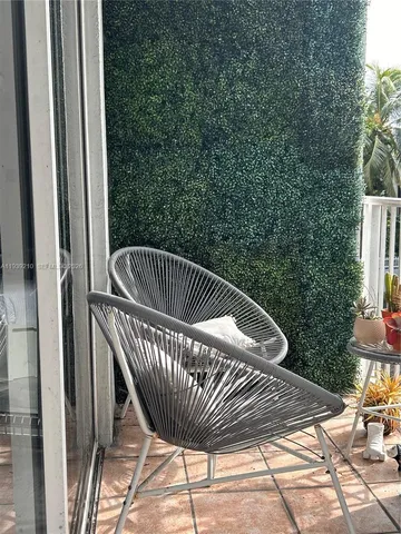 a view of balcony with furniture