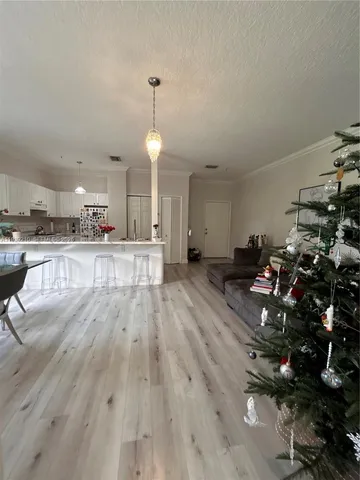 a view of a living room and kitchen floor