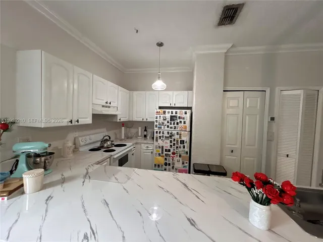 a bed room with a bed and a chair